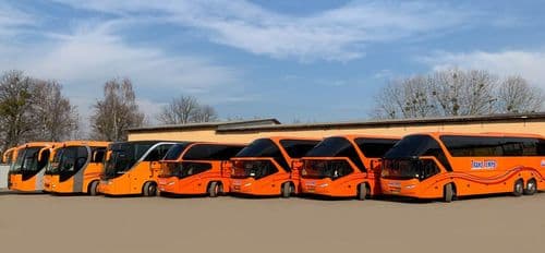 Сучасний автопарк перевізника TransTempo на atatickets.com: лінійка комфортабельних автобусів Neoplan Starliner та MAN для безпечних міжнародних пасажирських перевезень.